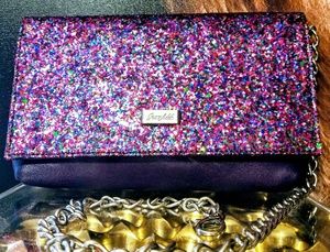 Purpler leather Grace Adele clutch.